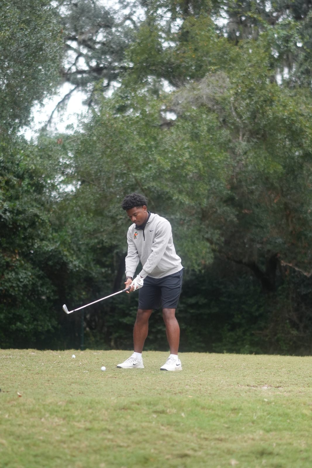 Golfer swinging on the back nine