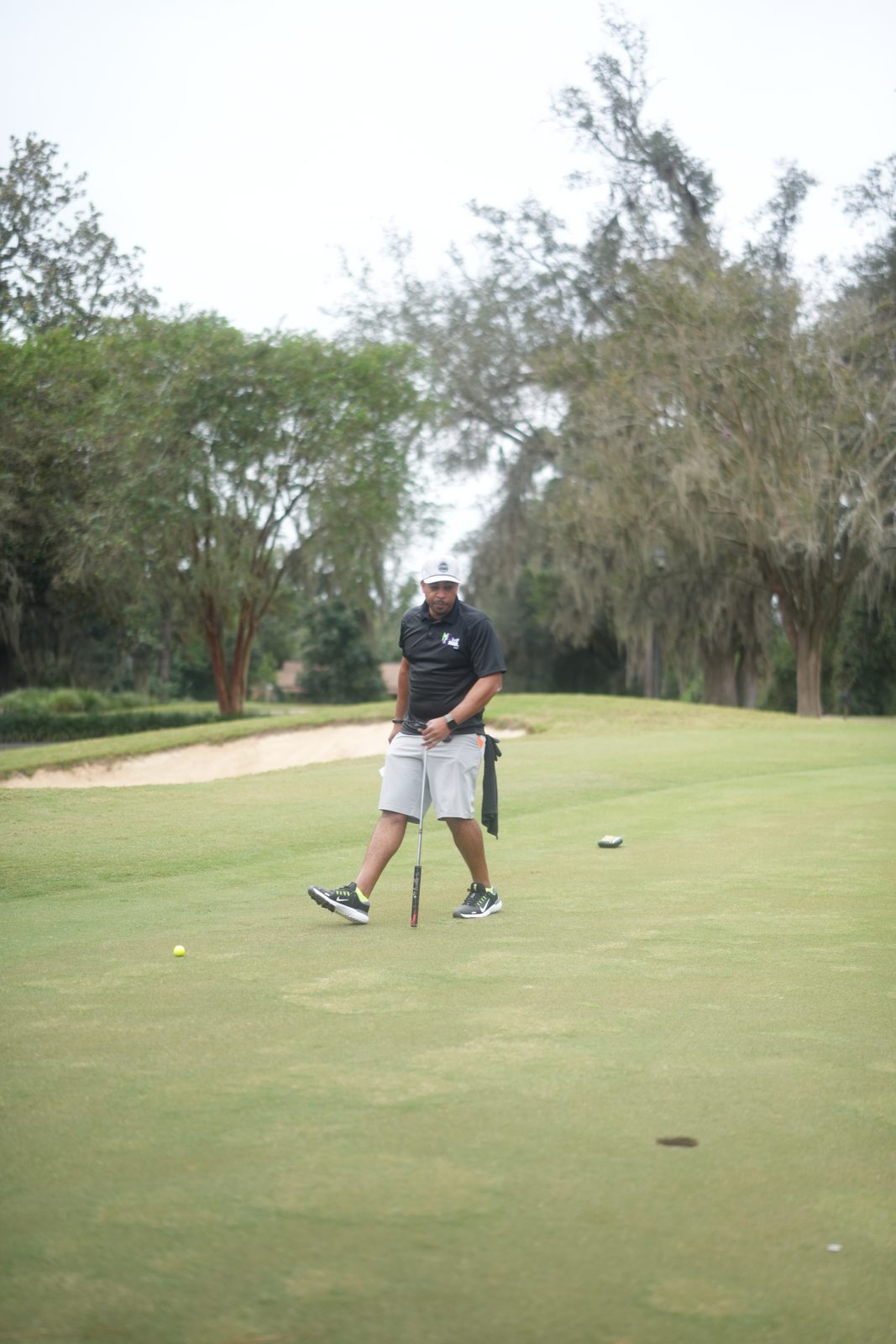 Golfer driving down the fairway