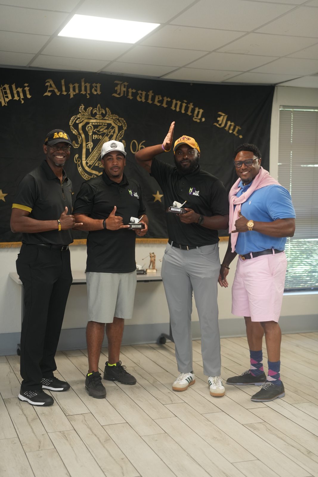 Golfers lined up on the tee box at the inaugural tournament