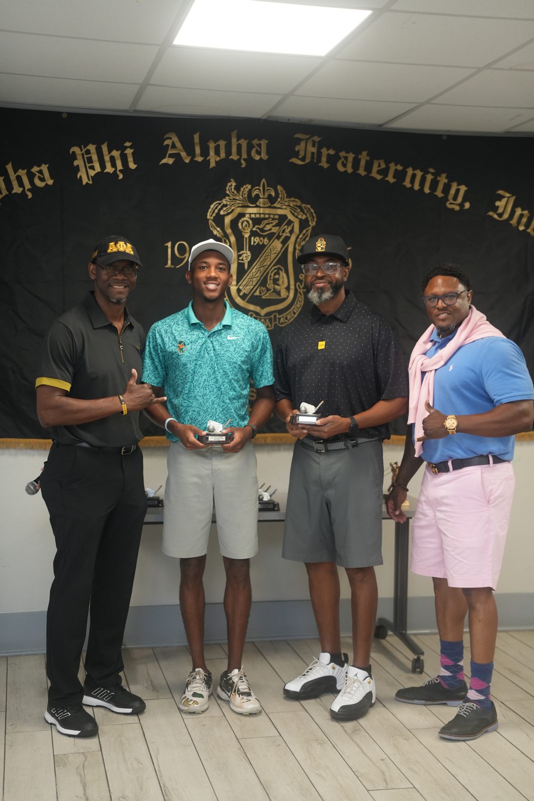 Group photo at the Alpha Phi Alpha banner